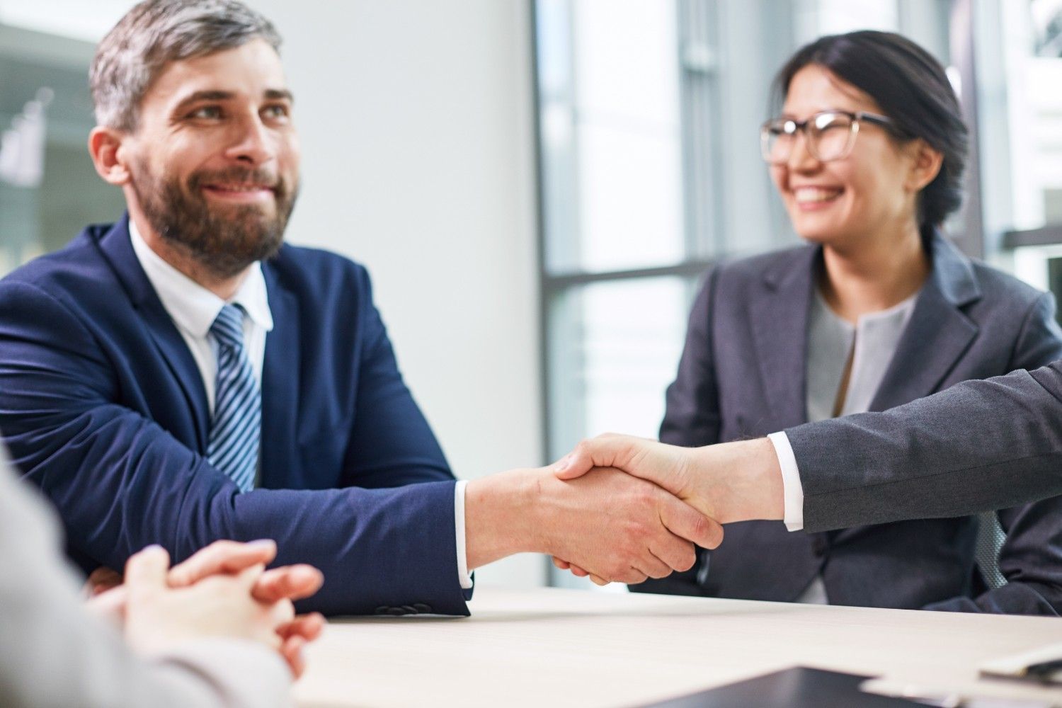 Successful agency-client agreement sealed with a handshake