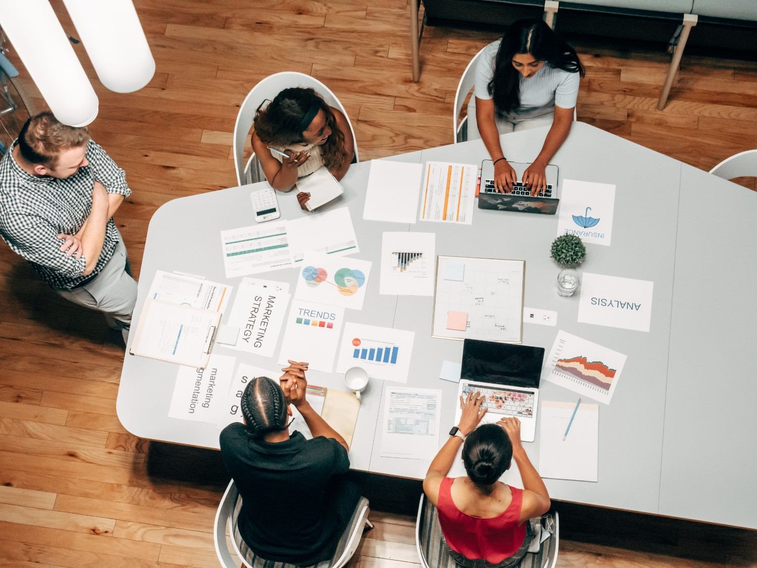 Overhead marketing strategy meeting conference table