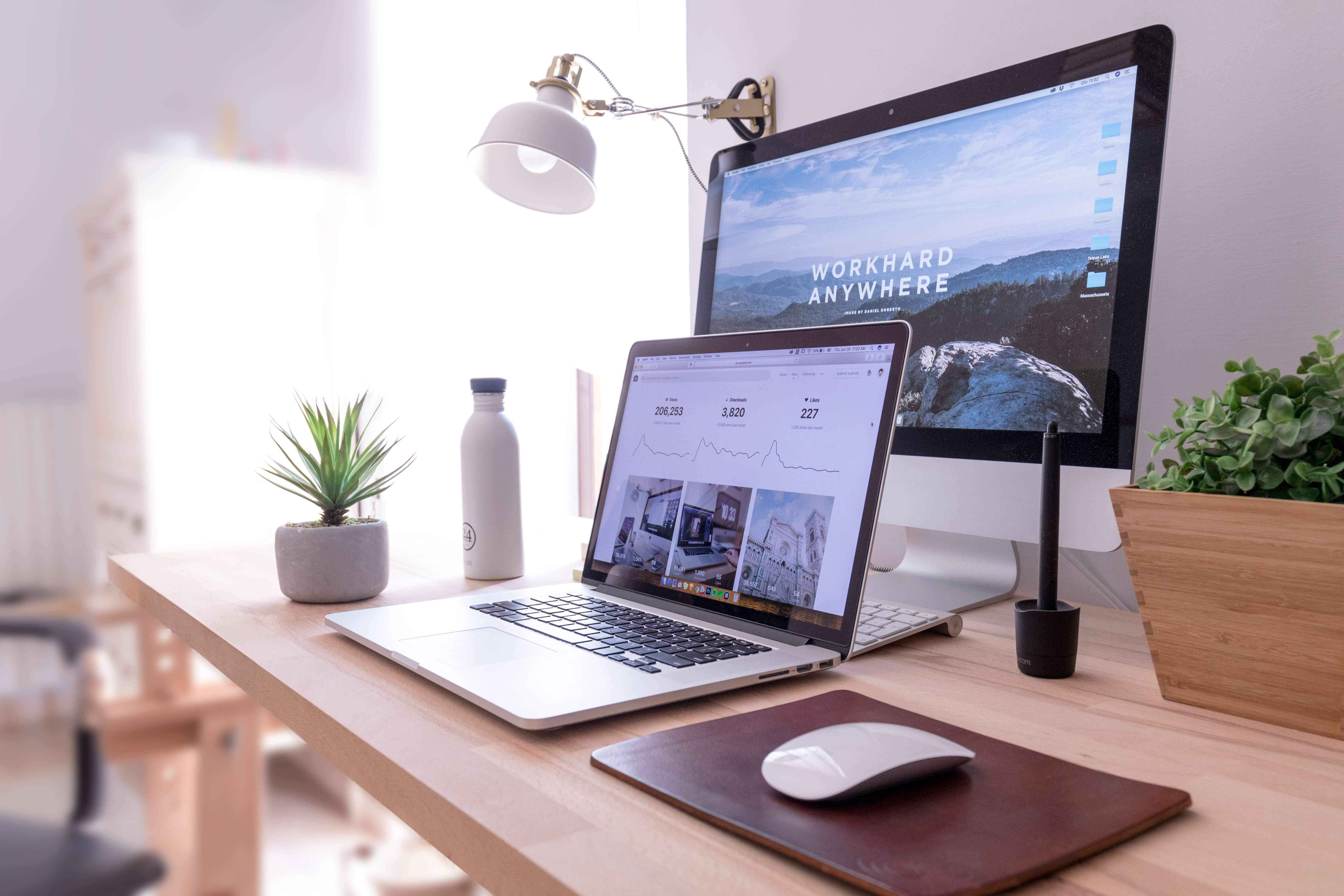 Laptop and desktop with websites screen