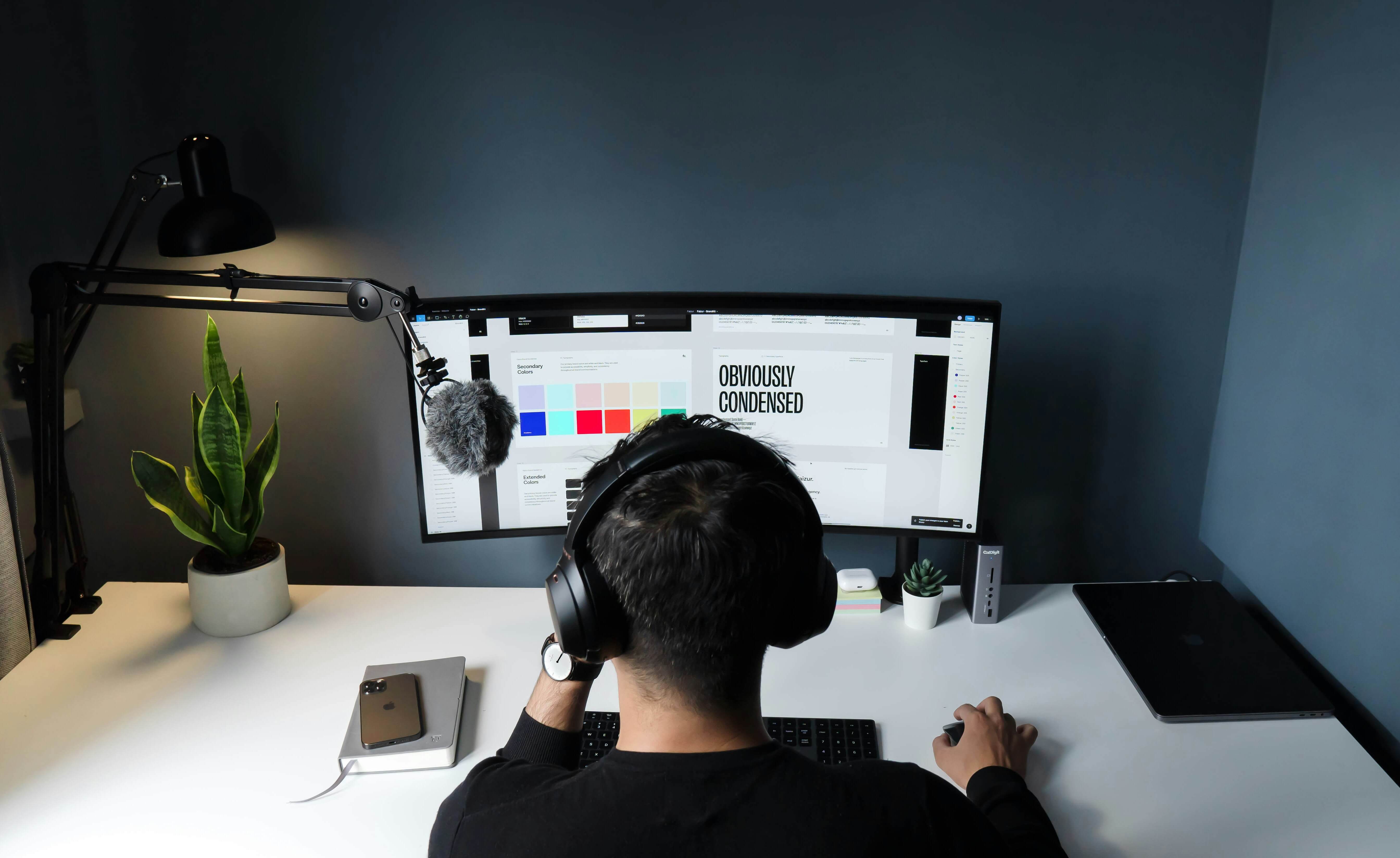 Man designing color palette and logo his computer