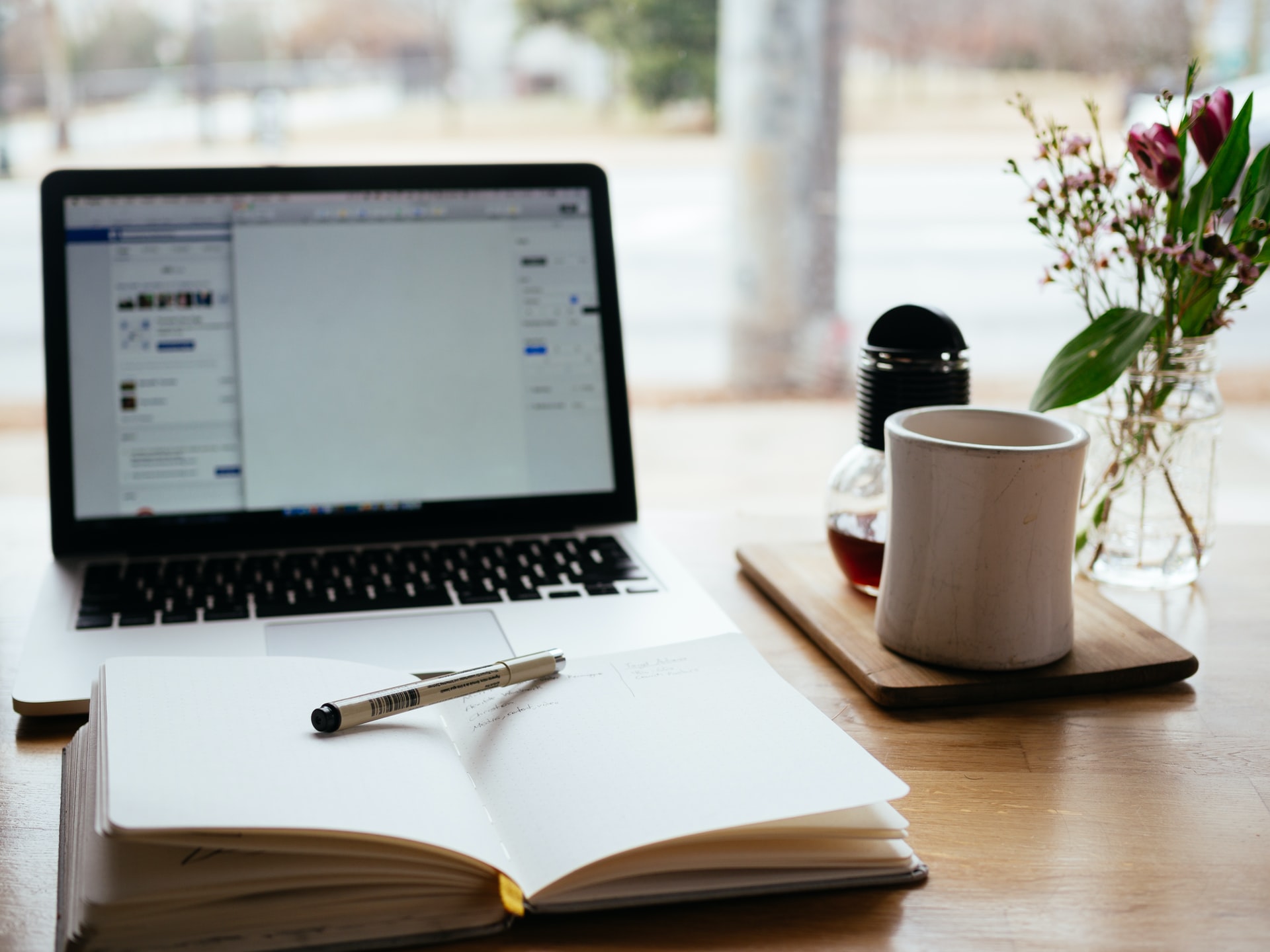 Laptop notepad social media plan