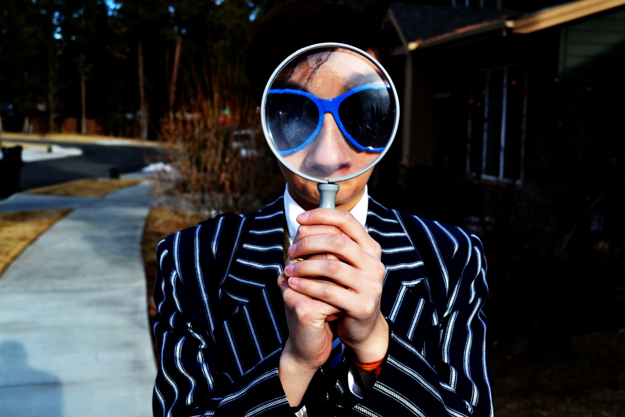 A person with magnifying glass