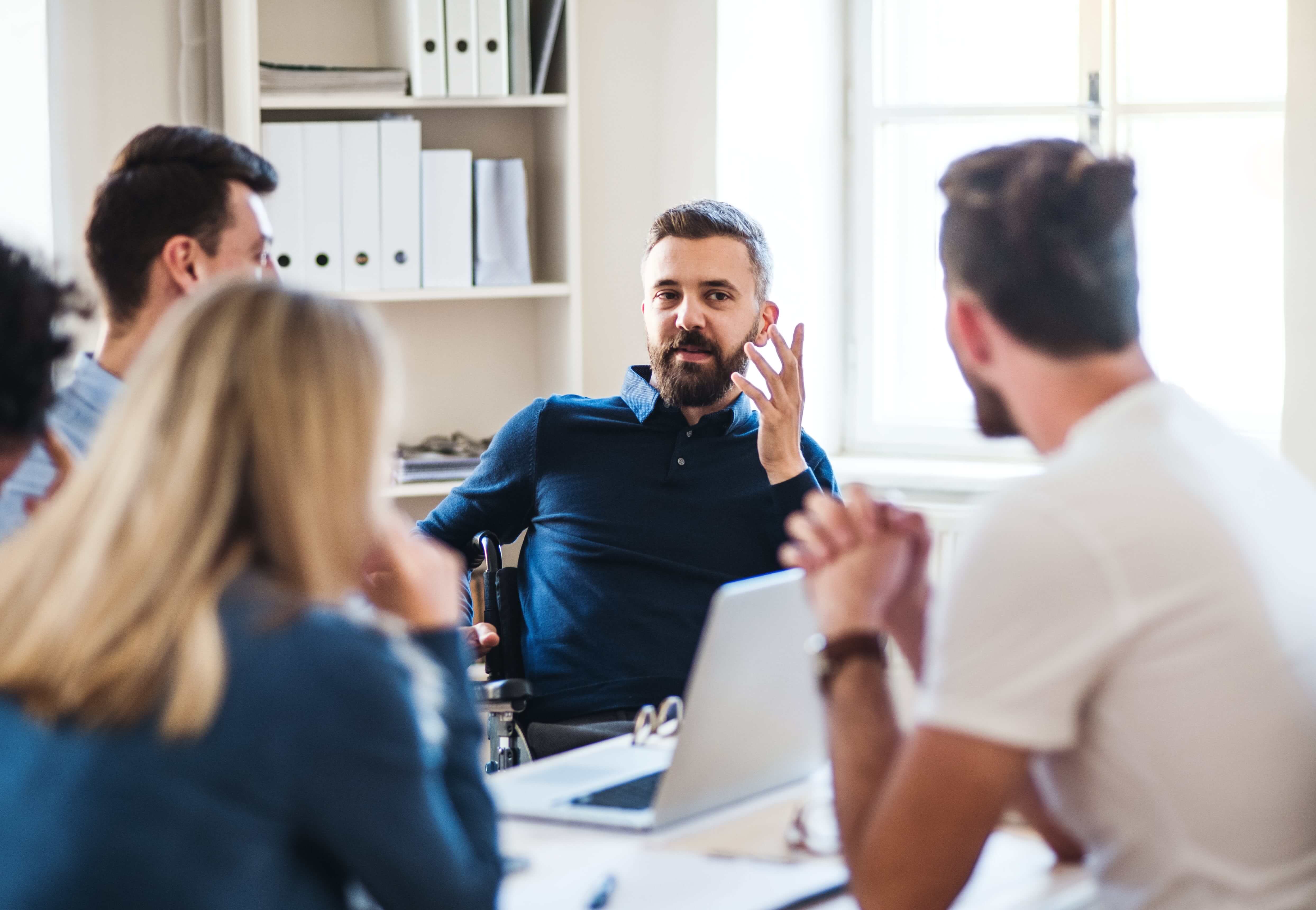 Businessman chair with colleagues working