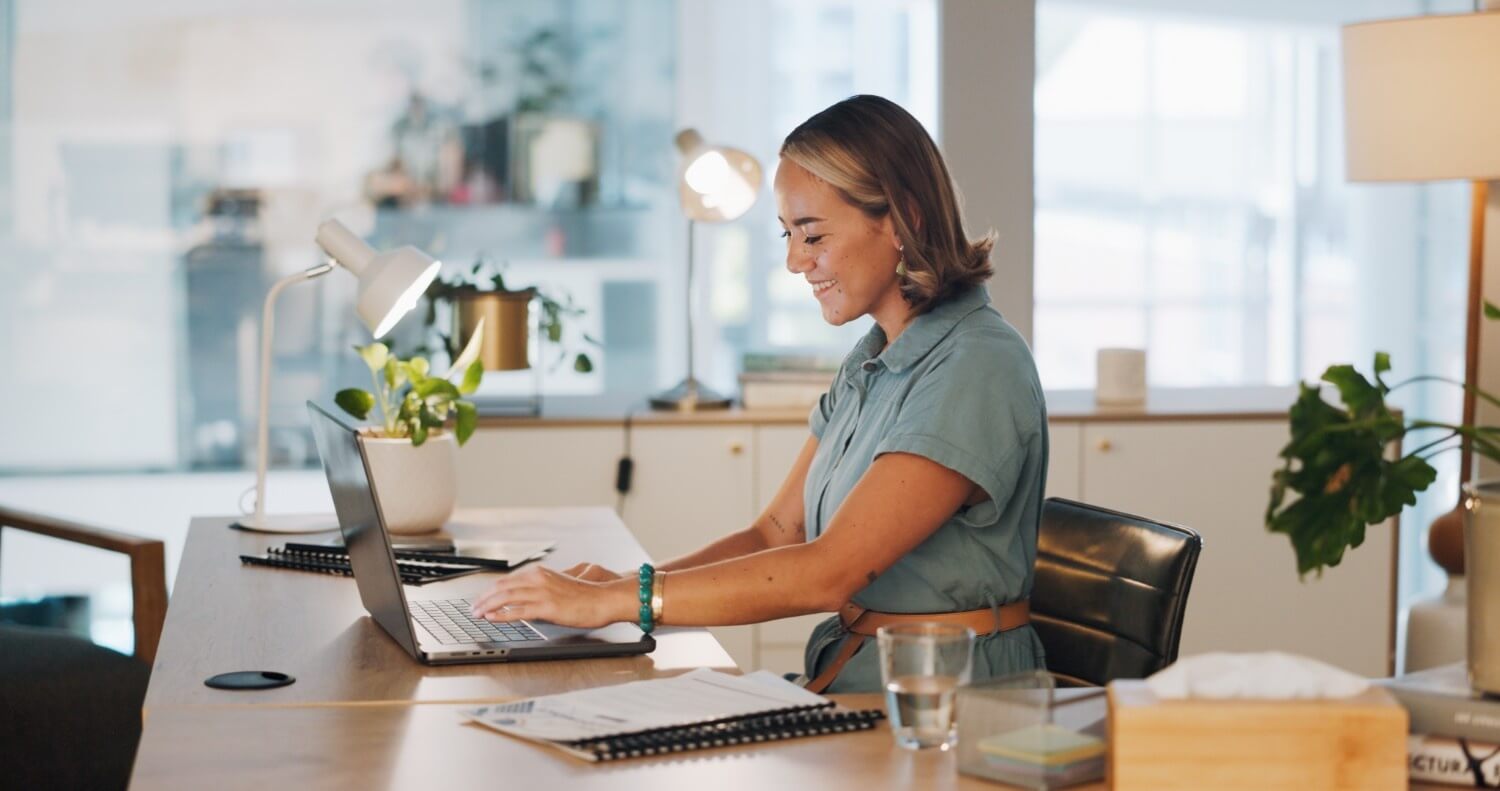 Smiling office worker modern desk