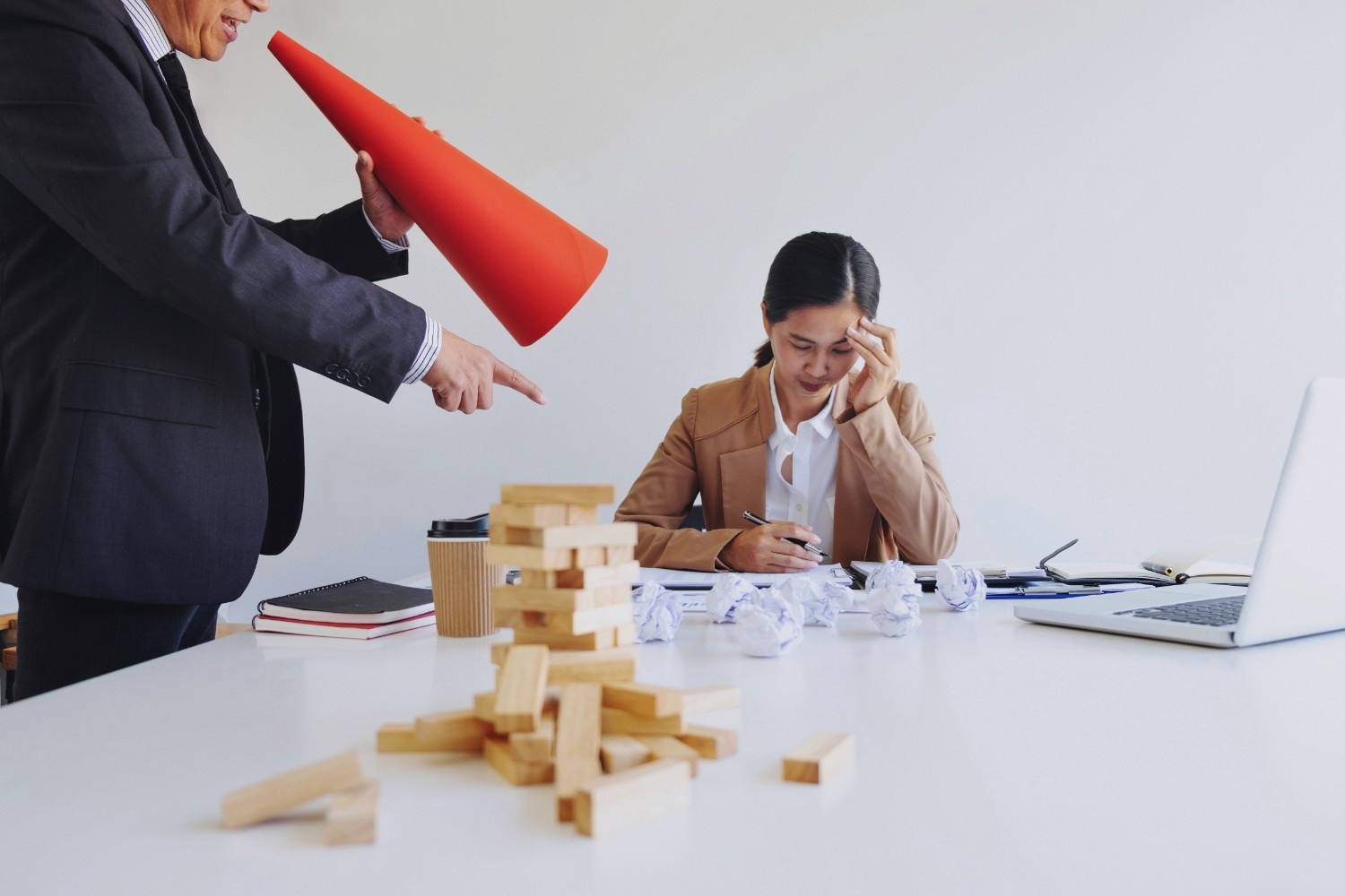 Stressed manager under high pressure in an agency office