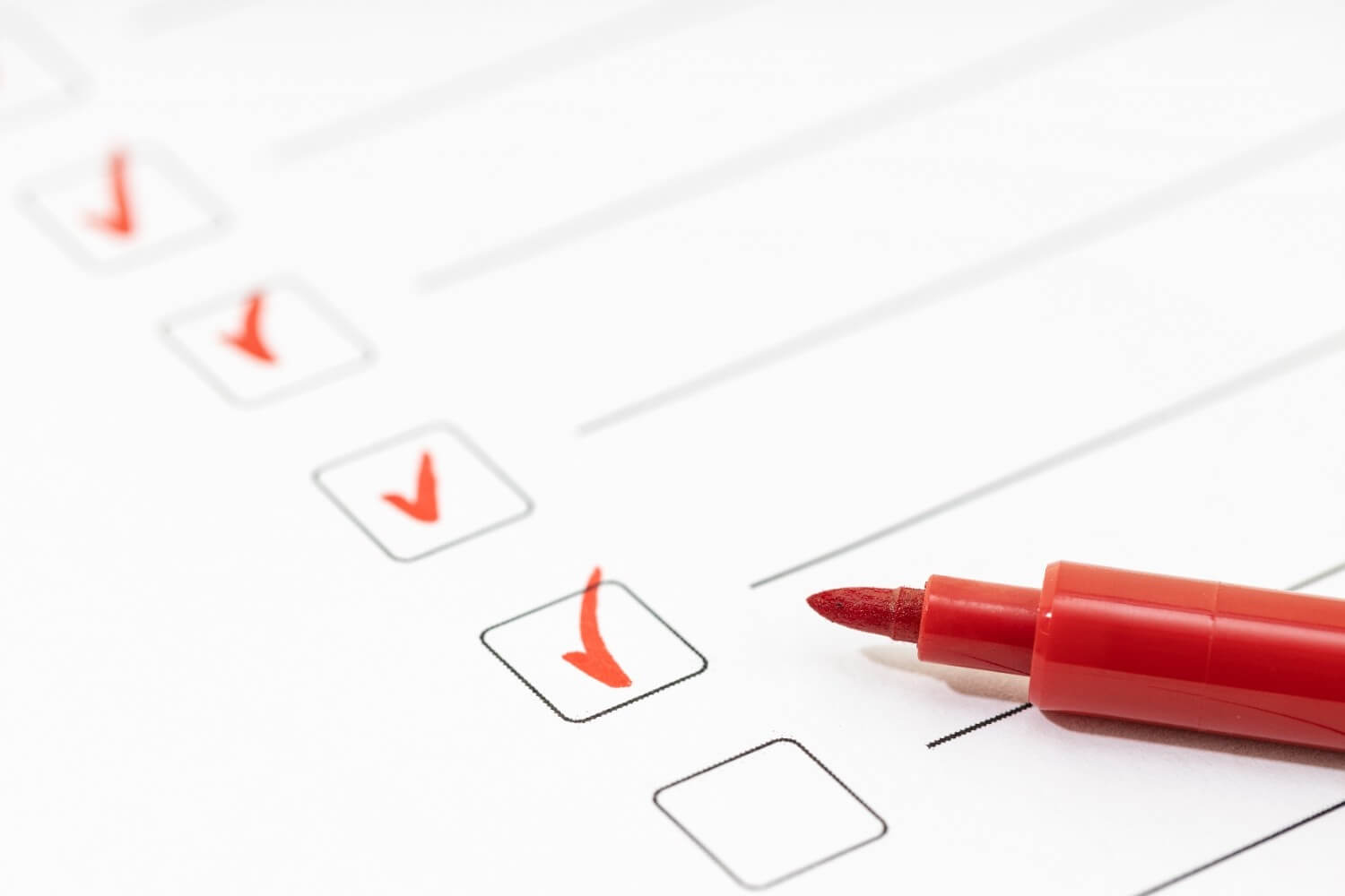 Checklist sheet and red marker check list complete