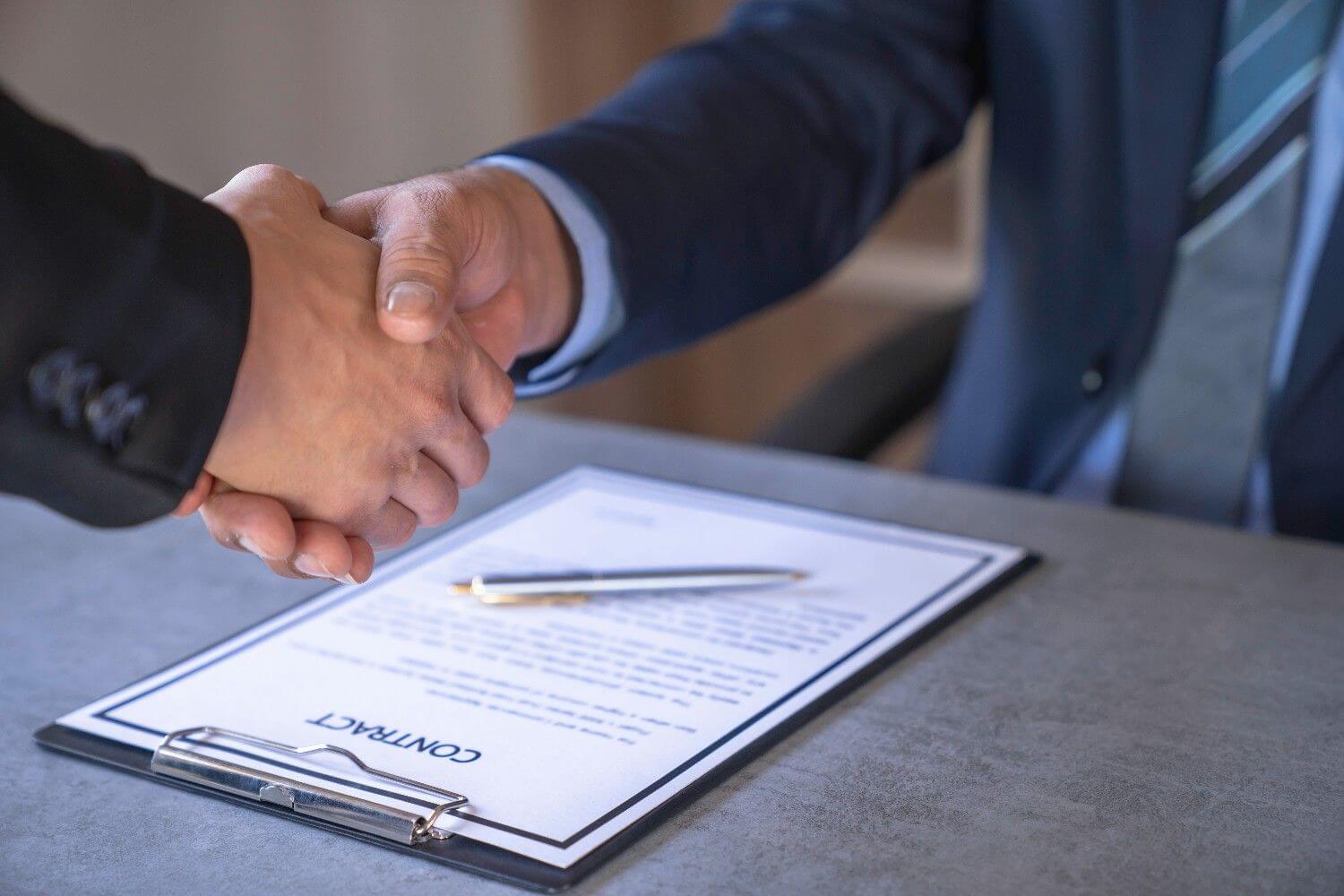 Businessmen politicians agree accept bribes shaking hands