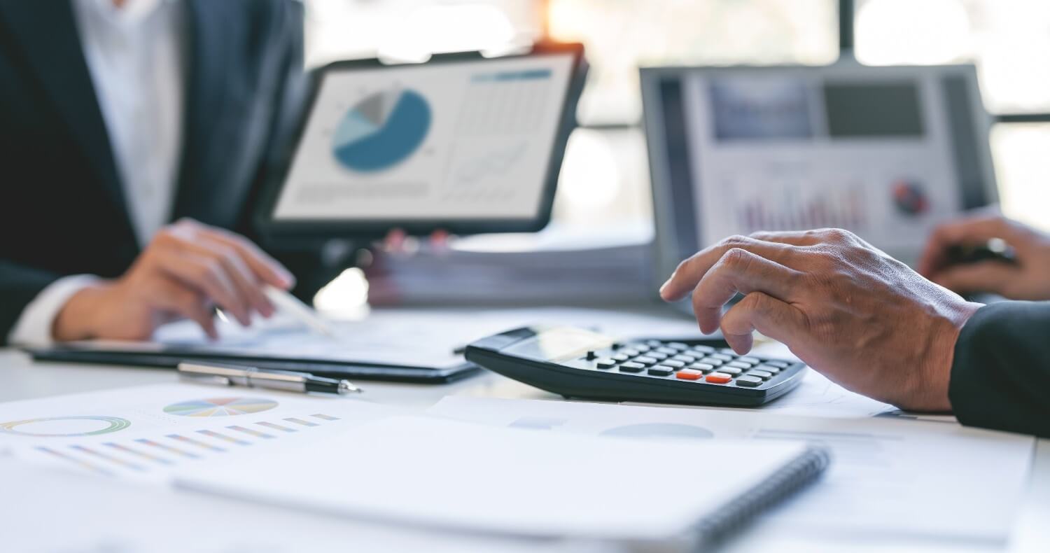 Financial analysts reviewing agency tax data in a planning meeting