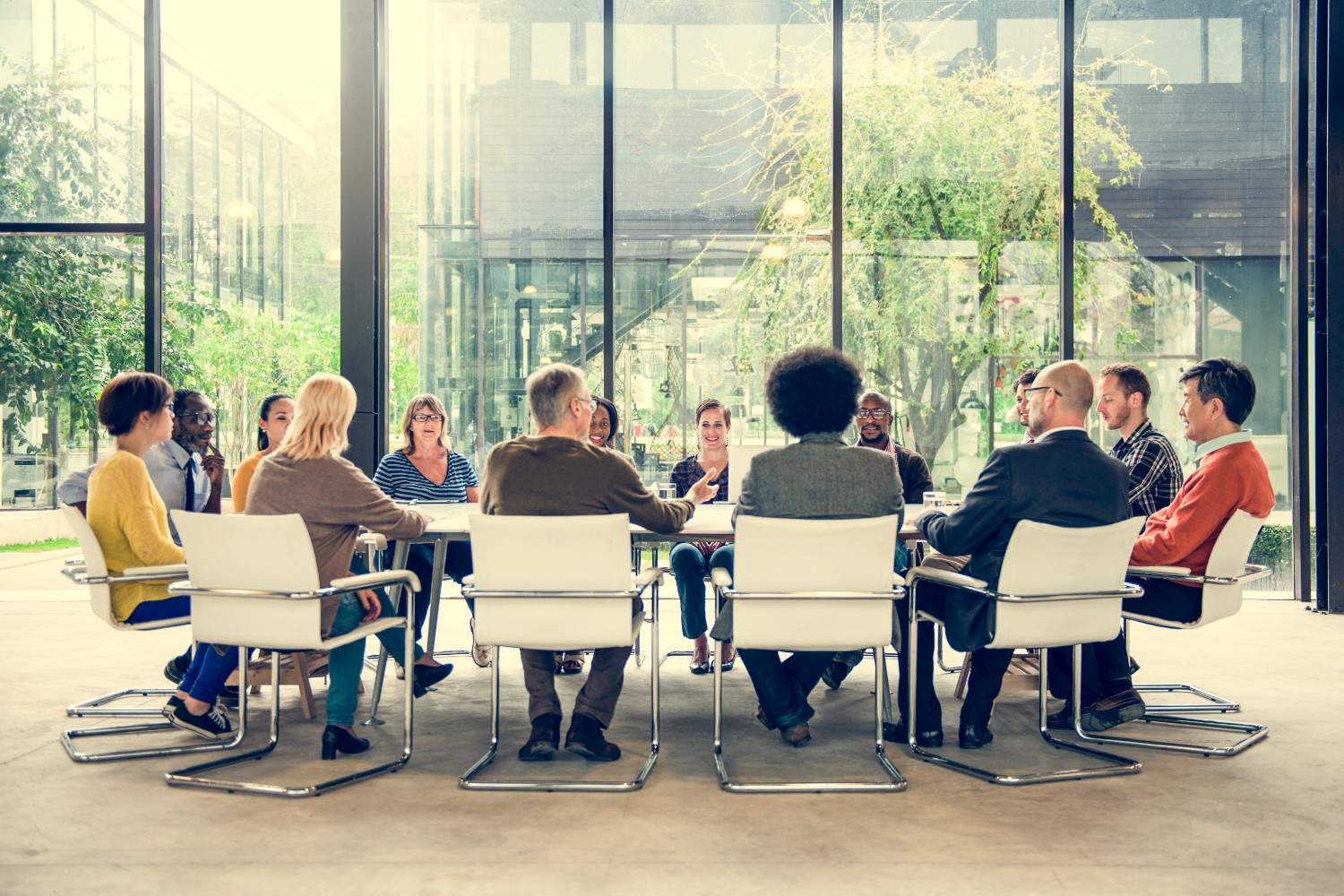 Corporate team meeting modern glass conference room
