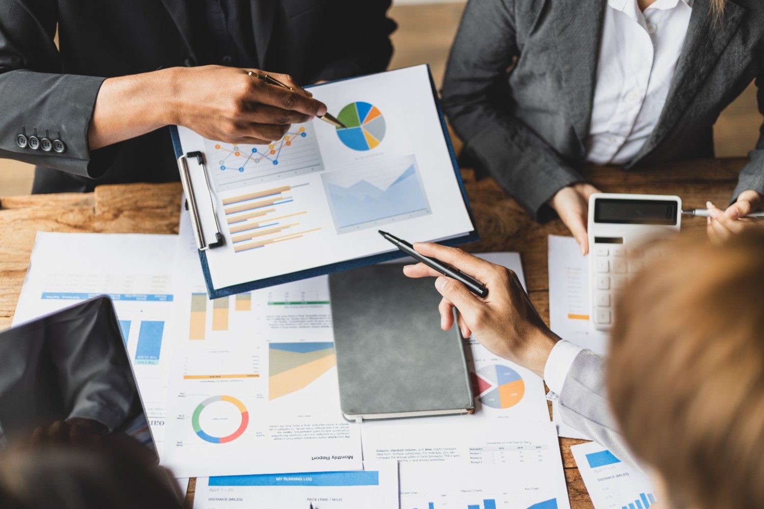 Business partners analyzing financial charts report