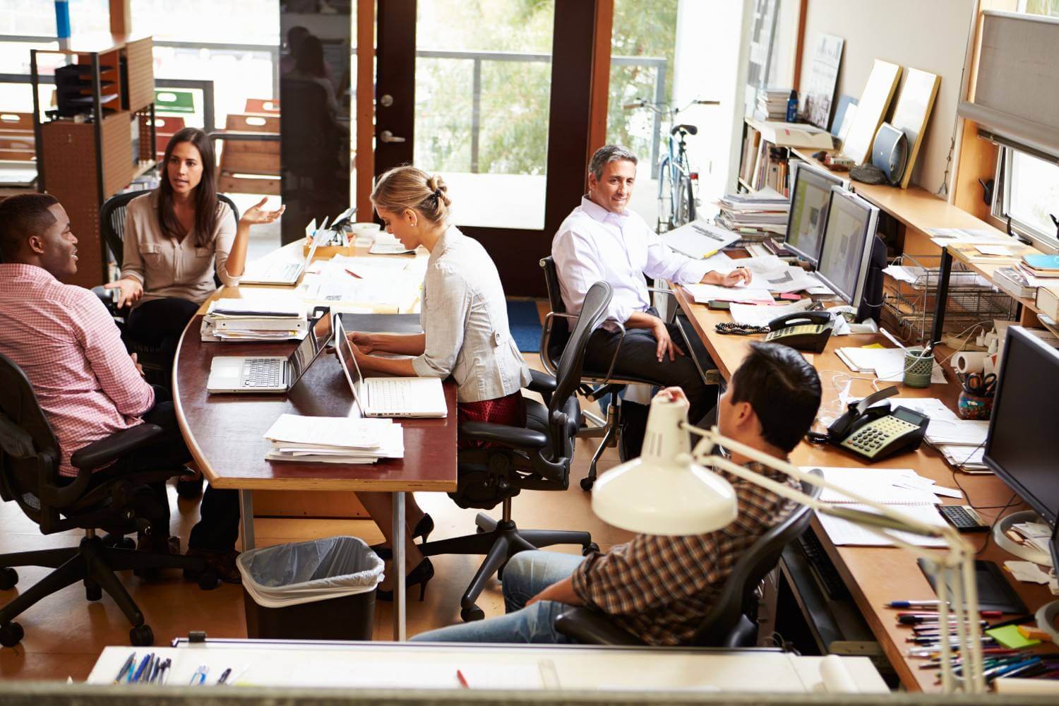 Interior busy office with staff working