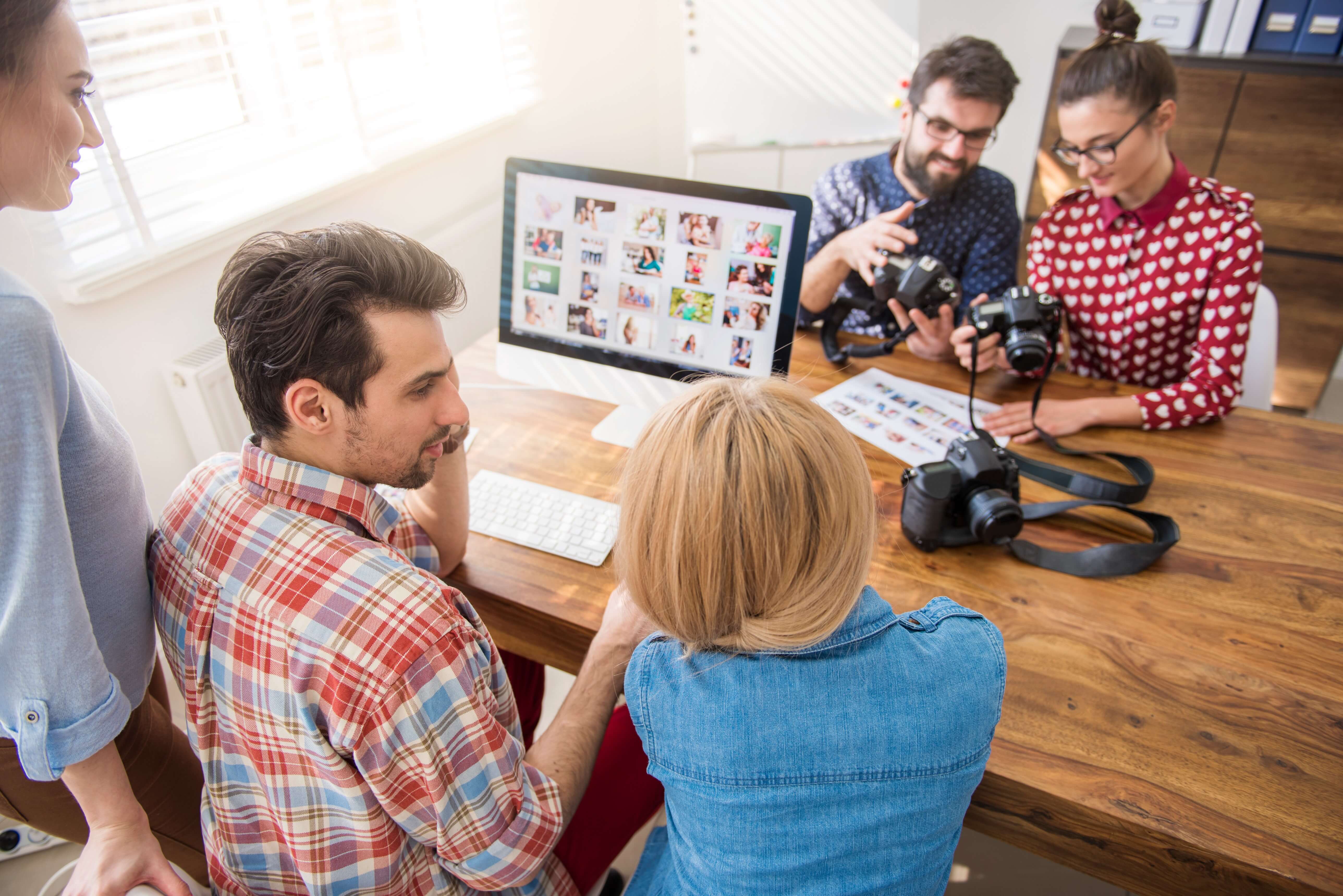 Group employees working marketing the office