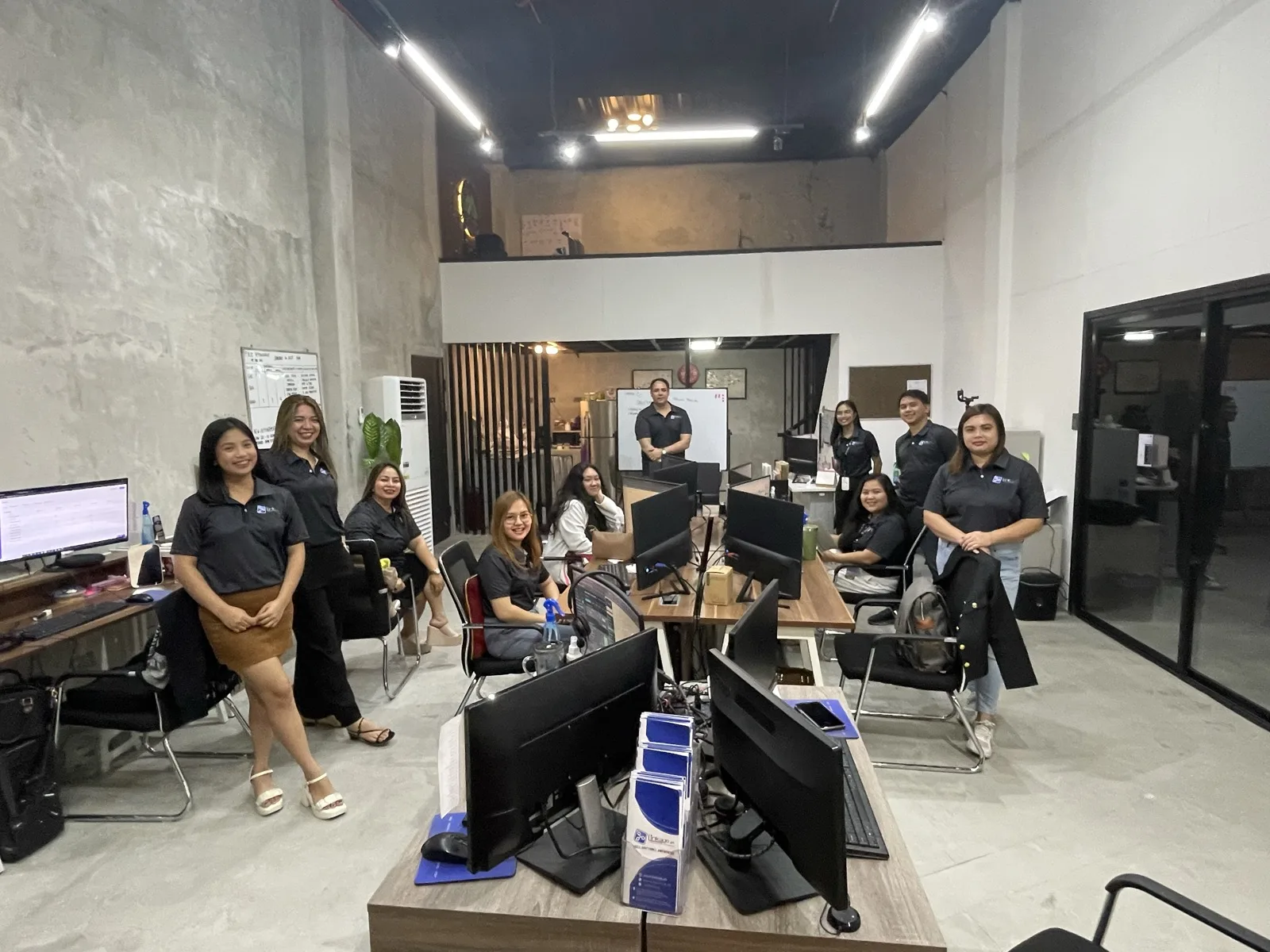 Murphy Consulting production team gathered together on the office floor