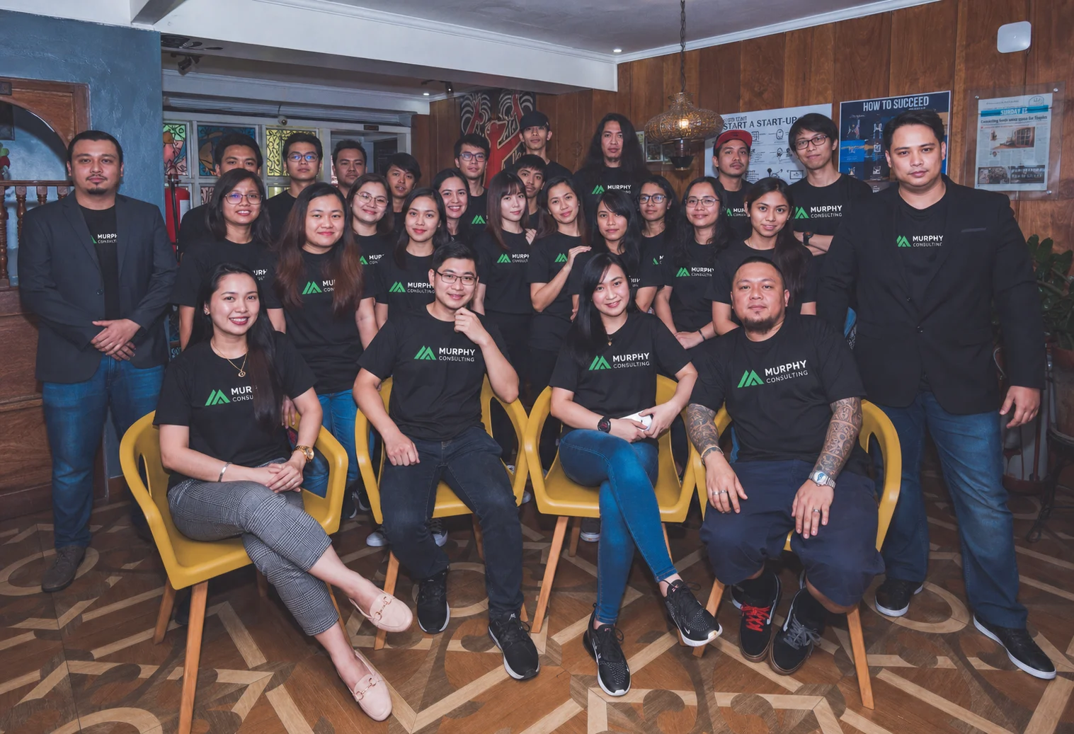 Murphy Consulting production team gathered together in branded shirts