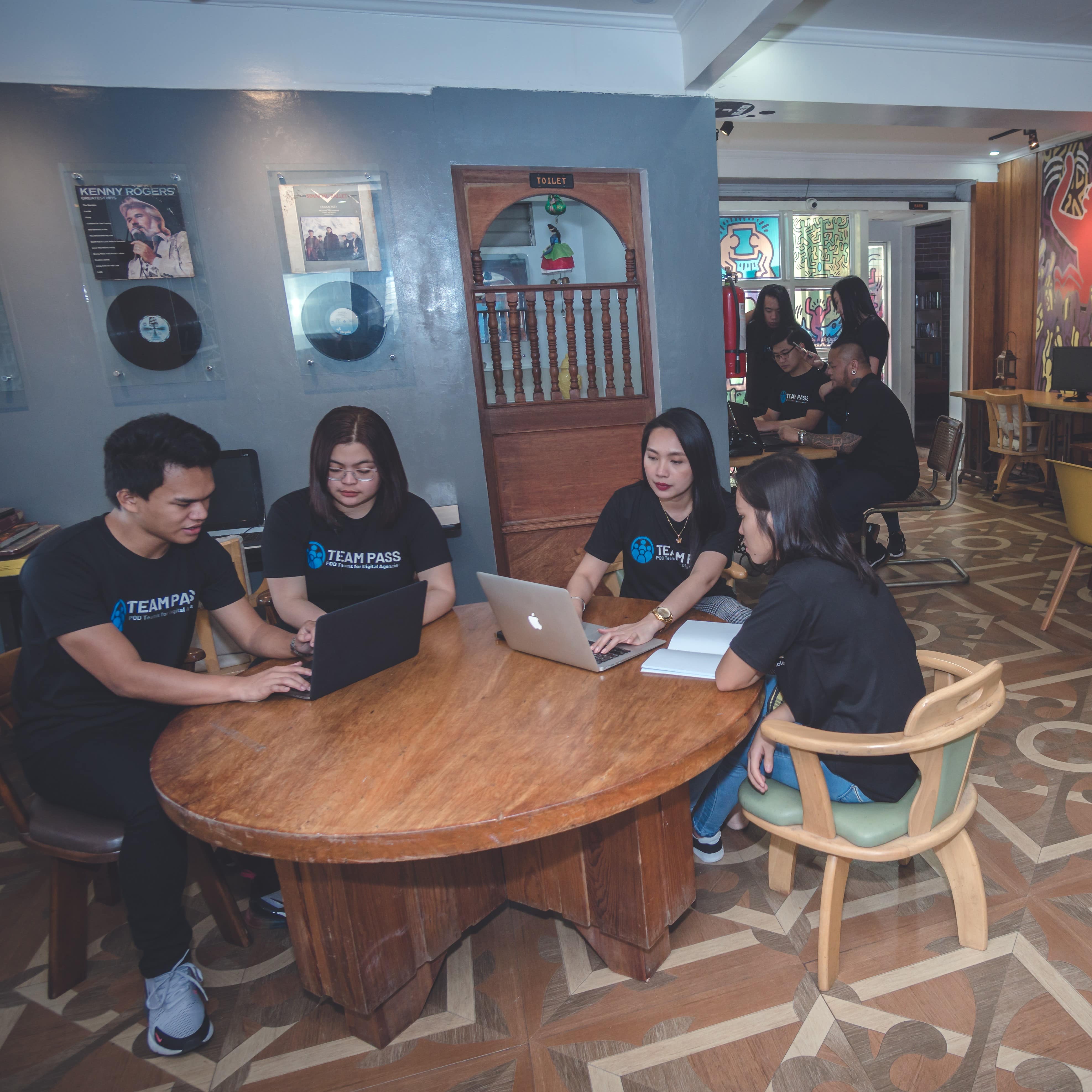 Production team meeting at a long conference table